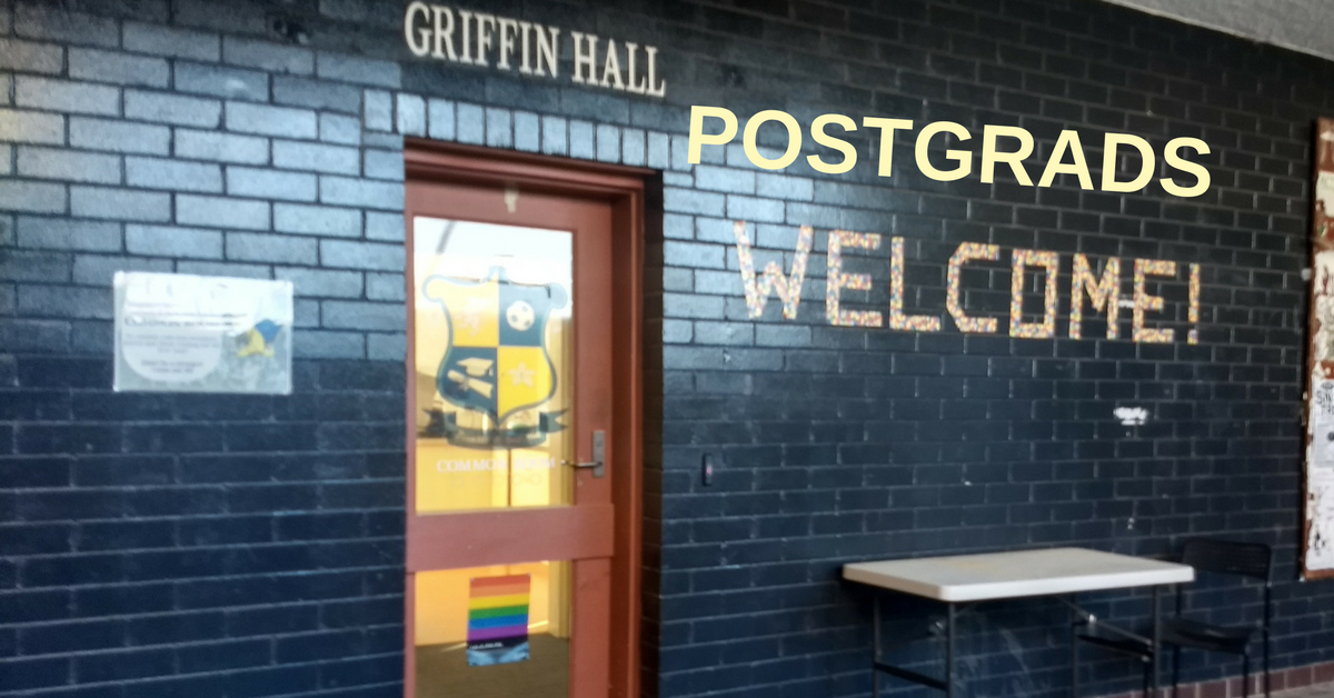 A picture of the outside of Griffin Hall, with a sign edited to read "Postgrads welcome"