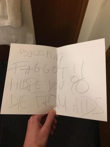 A note reading: "Disgusting Faggot! I hope you die from AIDS".