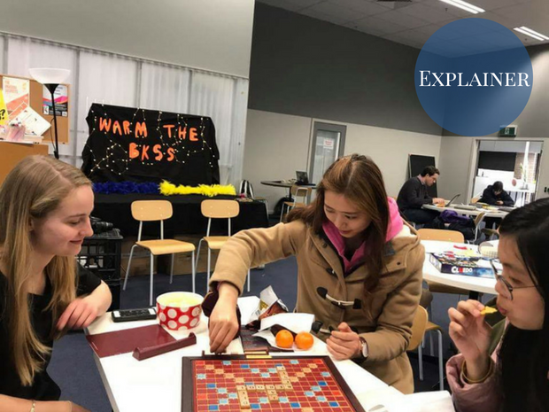 Students playing a board game in the BKSS