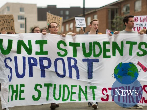 Students holding a banner that reads "Uni students support the student strikers"