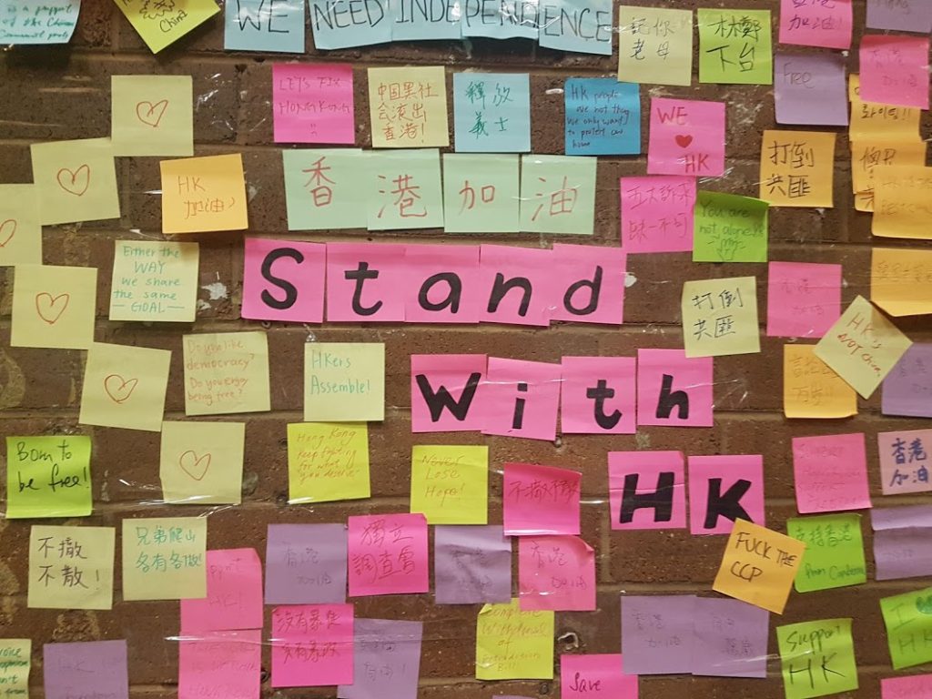 Post-its saying Stand with HK