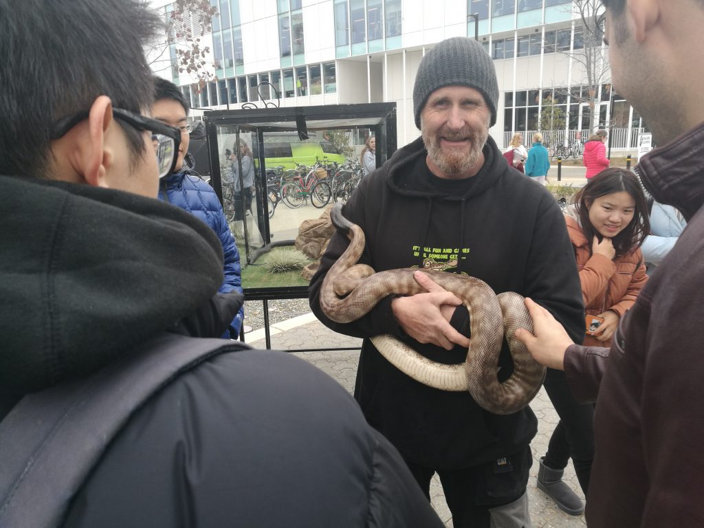 A man holding a snake